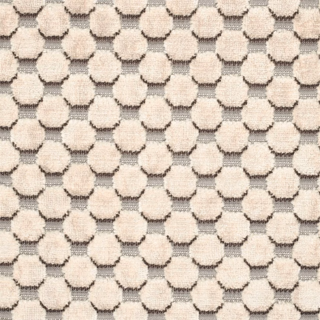 Close-up of cool pearl velvet with raised cream spots and silver-grey outlines