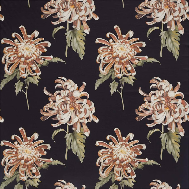 Large ivory chrysanthemums with rust petals and sage leaves on near-black fabric