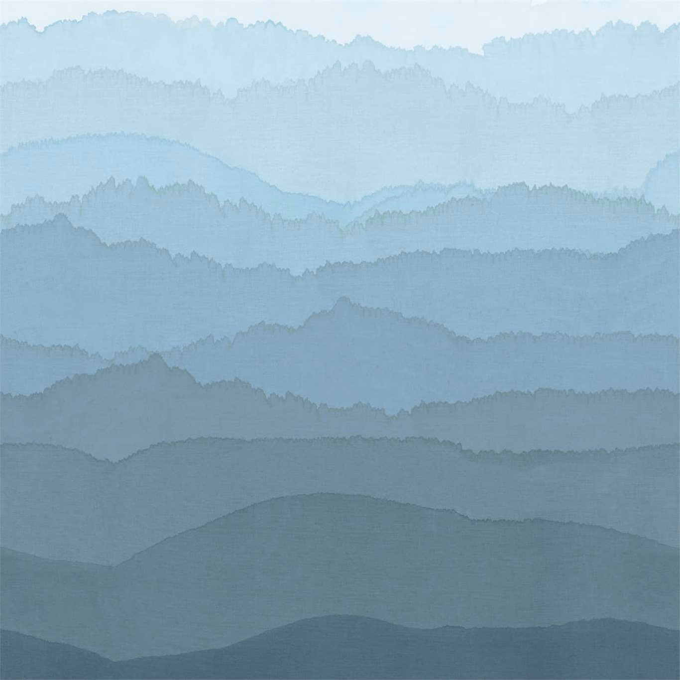 Layered blue-grey mountain landscape with misty pale blue bands