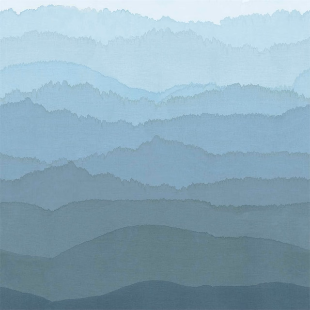 Layered blue-grey mountain landscape with misty pale blue bands