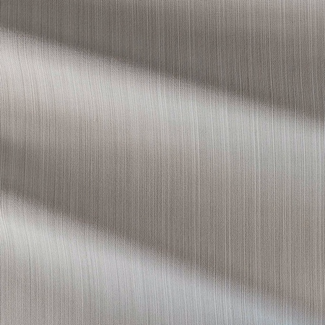 Pale chalk-grey outdoor fabric showing fine vertical woven texture in close-up
