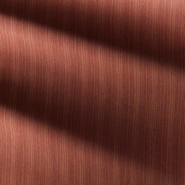 Close-up of russet red strié fabric with fine vertical ribbing and tonal brown shadowing