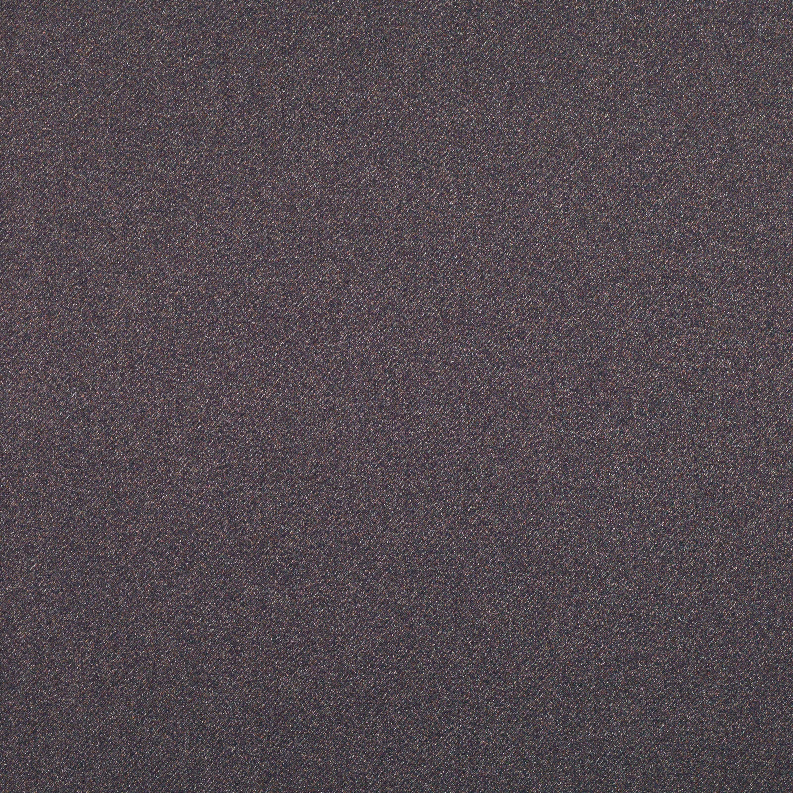 Close-up of dark plum-brown fabric with fine charcoal mottling and a granular surface