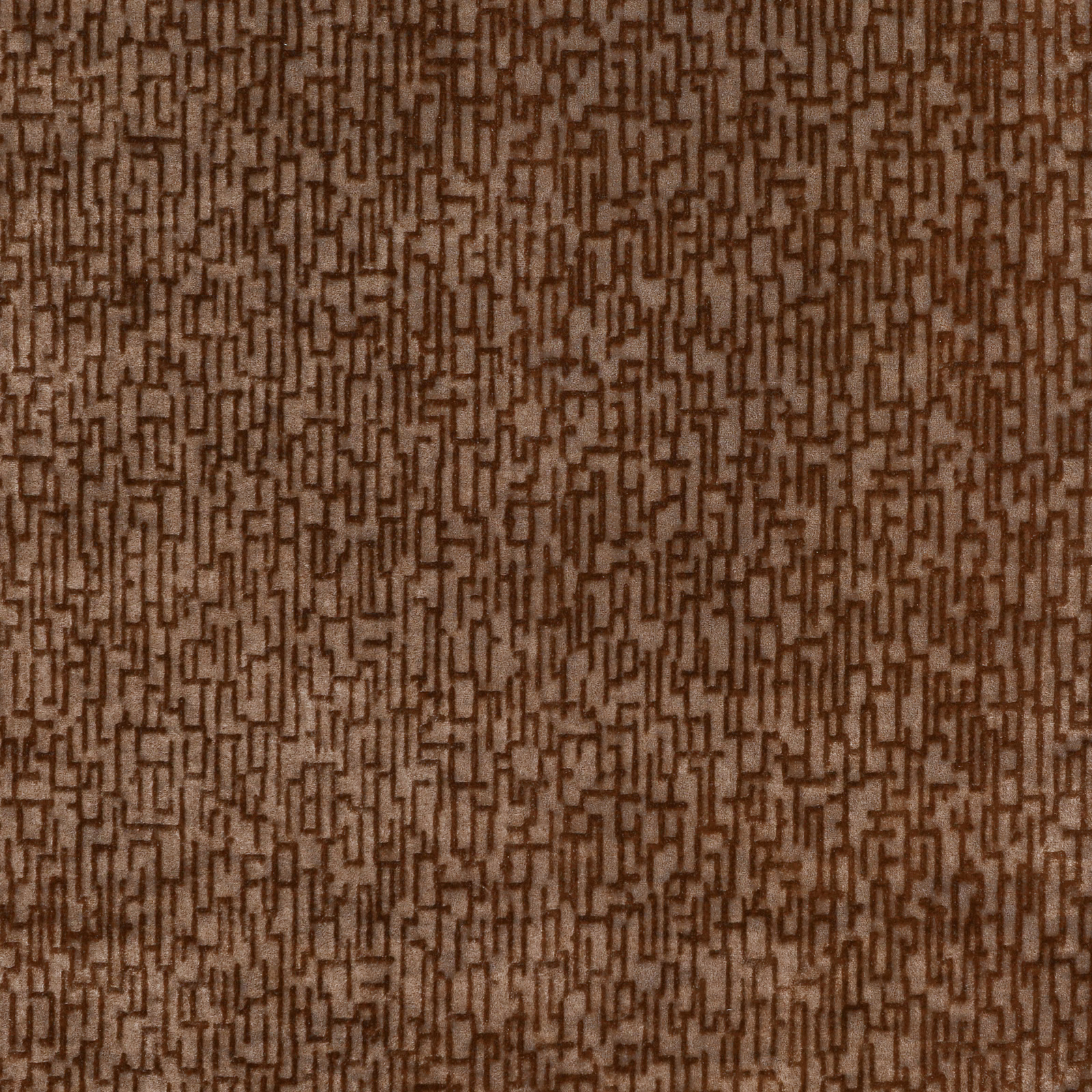 Warm cognac-brown textile with dense broken maze-like geometric weave