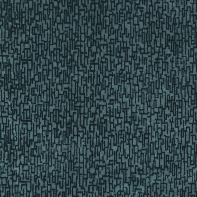 Deep blue-teal woven fabric with a dense charcoal maze-like linear pattern