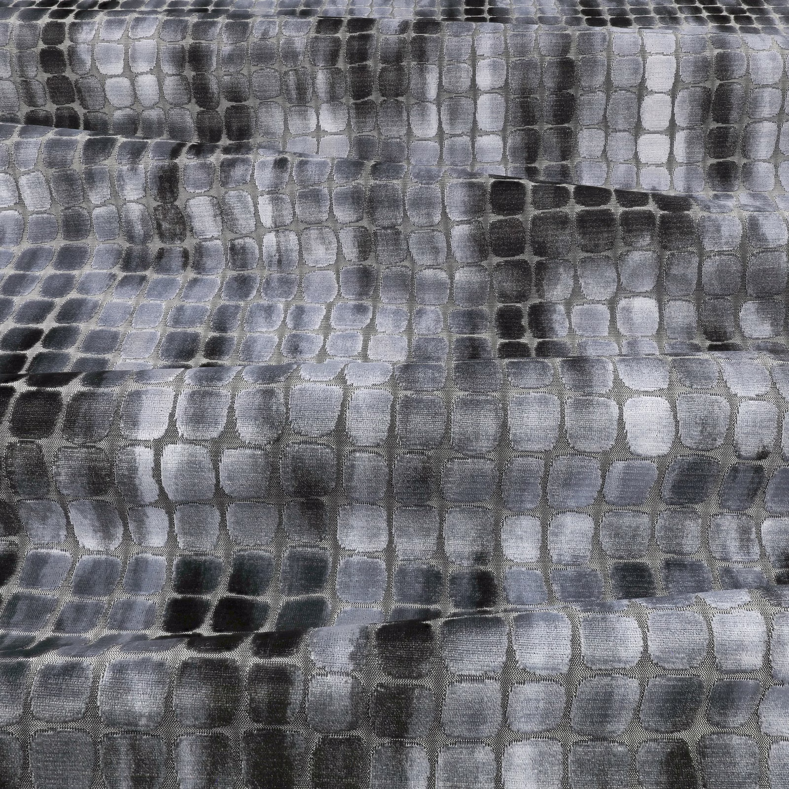 Cool blue-grey textile with irregular charcoal and silver rectangular cells in a softly textured weave