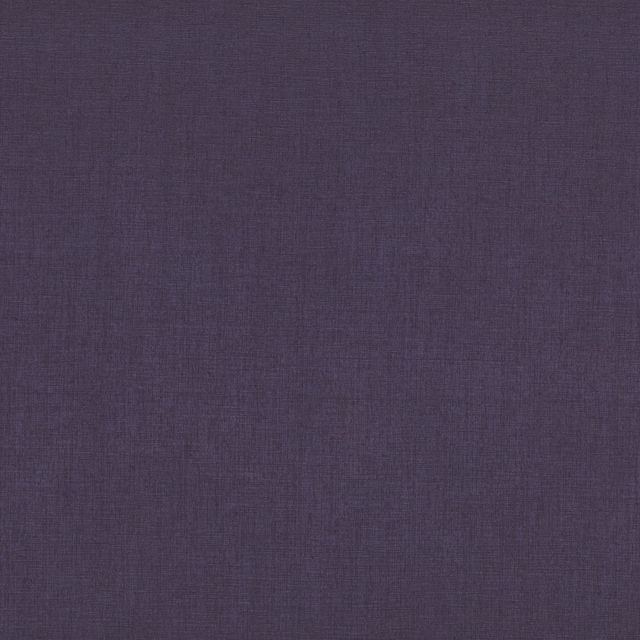 Close-up of charcoal-violet Elara fabric with a subtle plain woven texture
