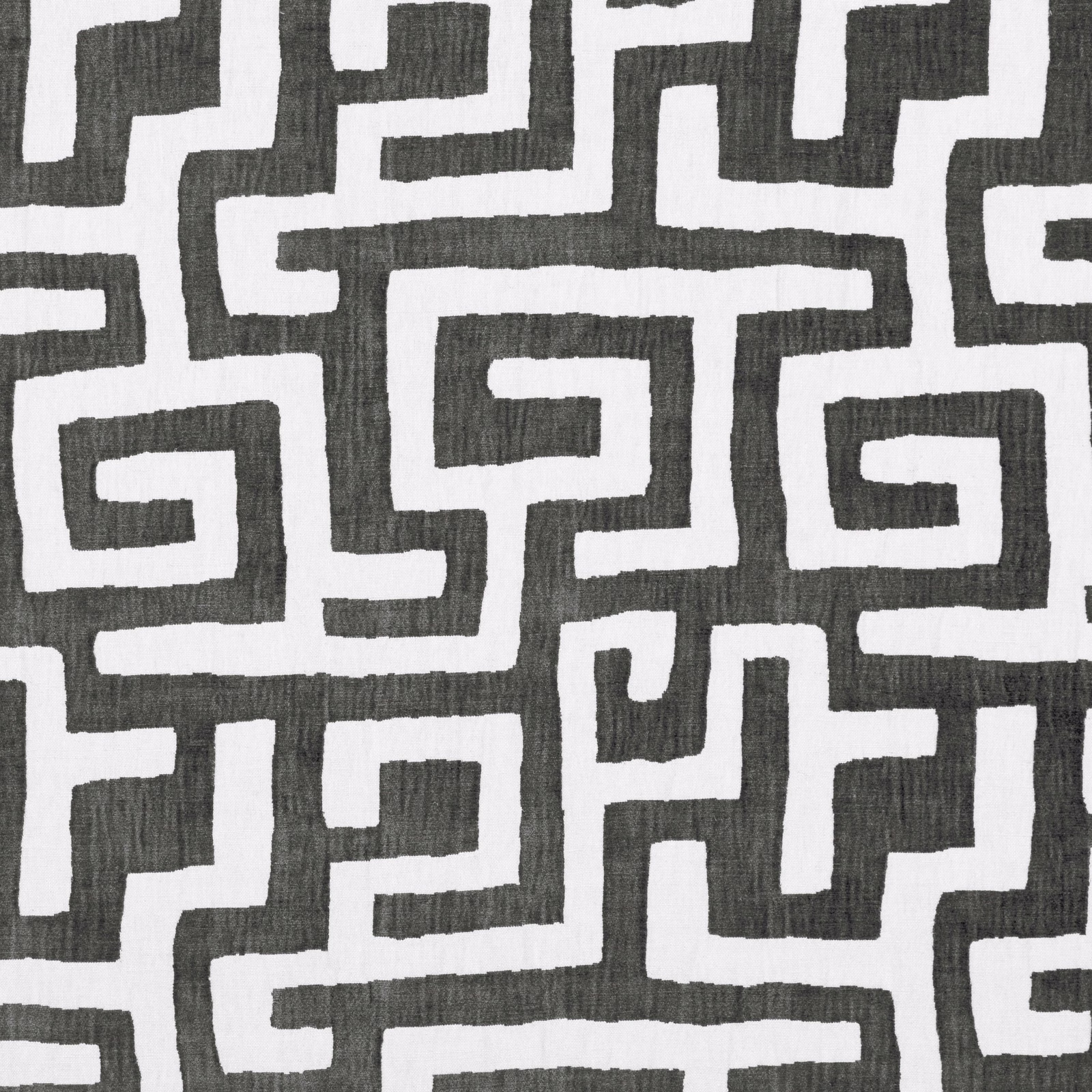 Charcoal and ivory woven fabric with an irregular interlocking maze pattern