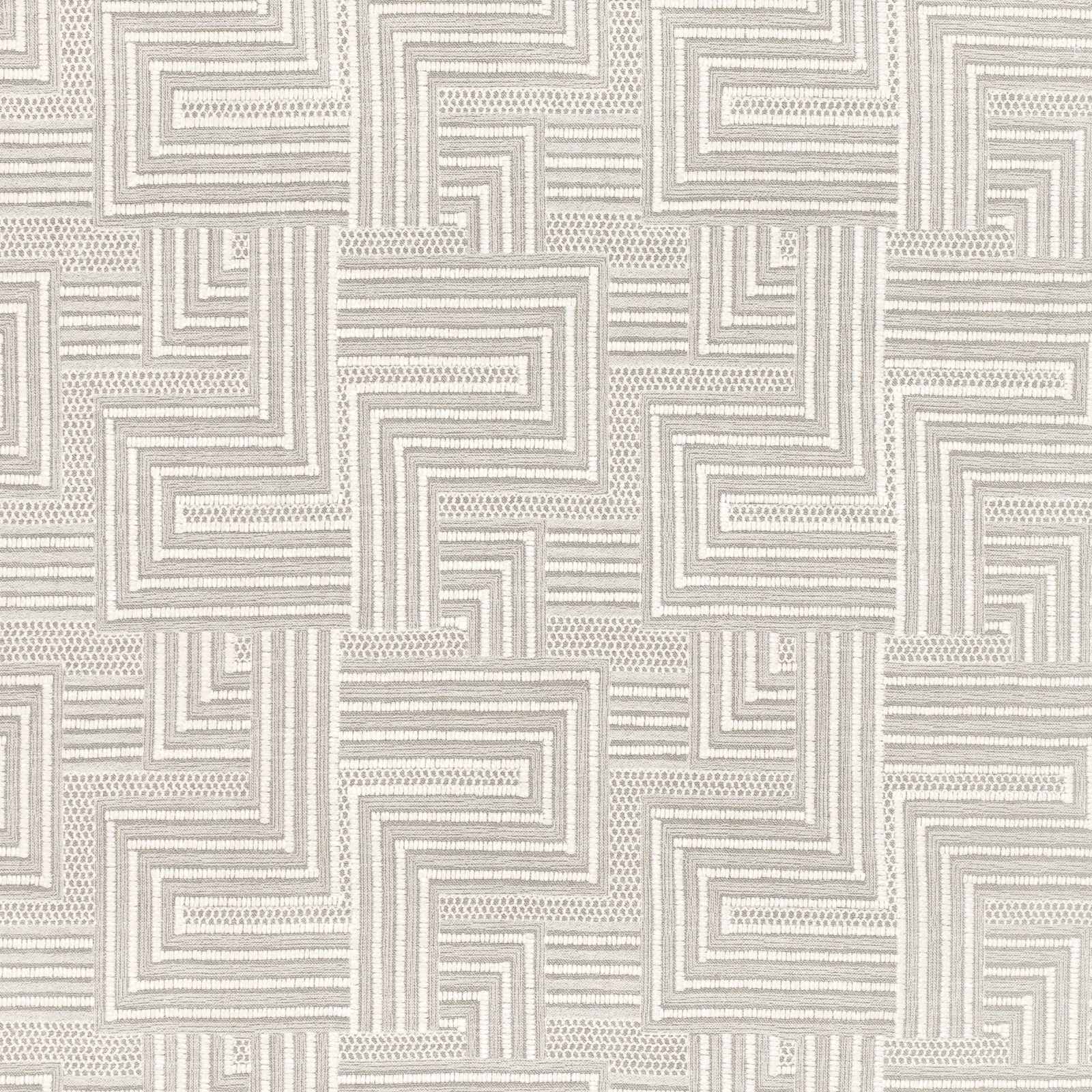 Pale greige and ivory woven fabric with interlocking maze bands and dotted texture