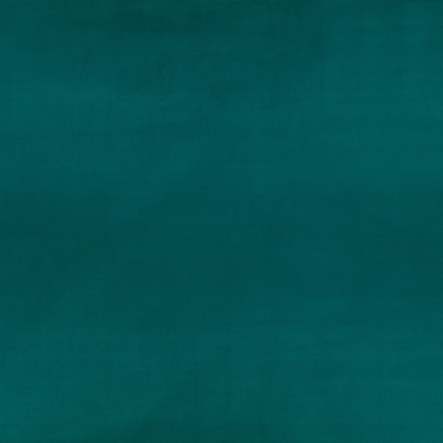 Deep electric teal wallpaper with a softly mottled, suede-like surface