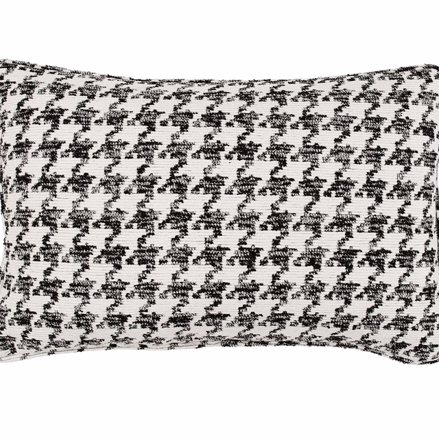Black and white woven cushion with a small irregular houndstooth pattern and tactile texture