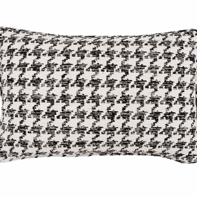 Black and ivory woven cushion with a small irregular houndstooth-like repeat