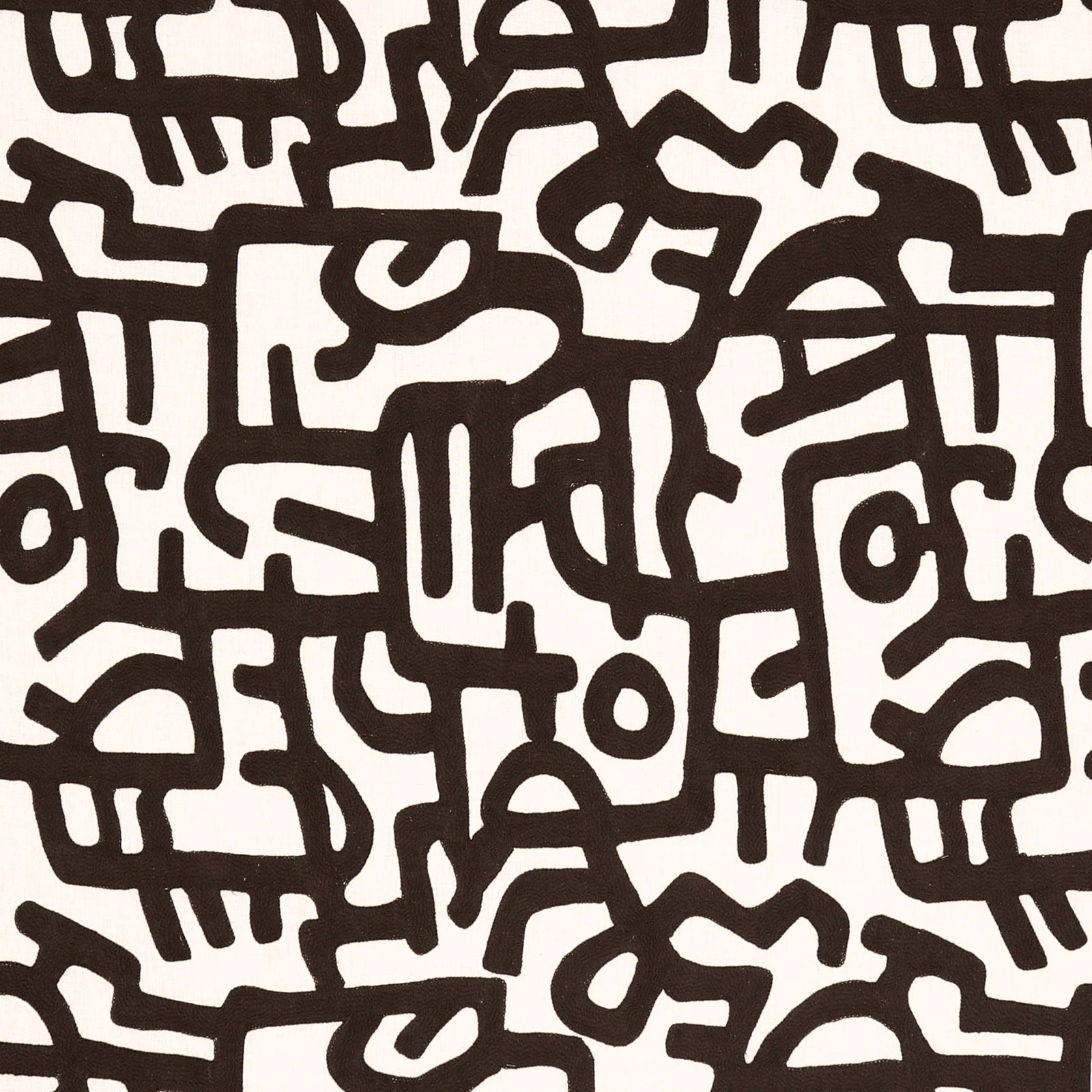 Ivory fabric with bold dark brown, interlocking abstract linework