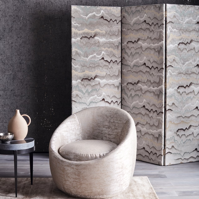 Cool stone-grey textile with layered wavy bands and softly brushed texture