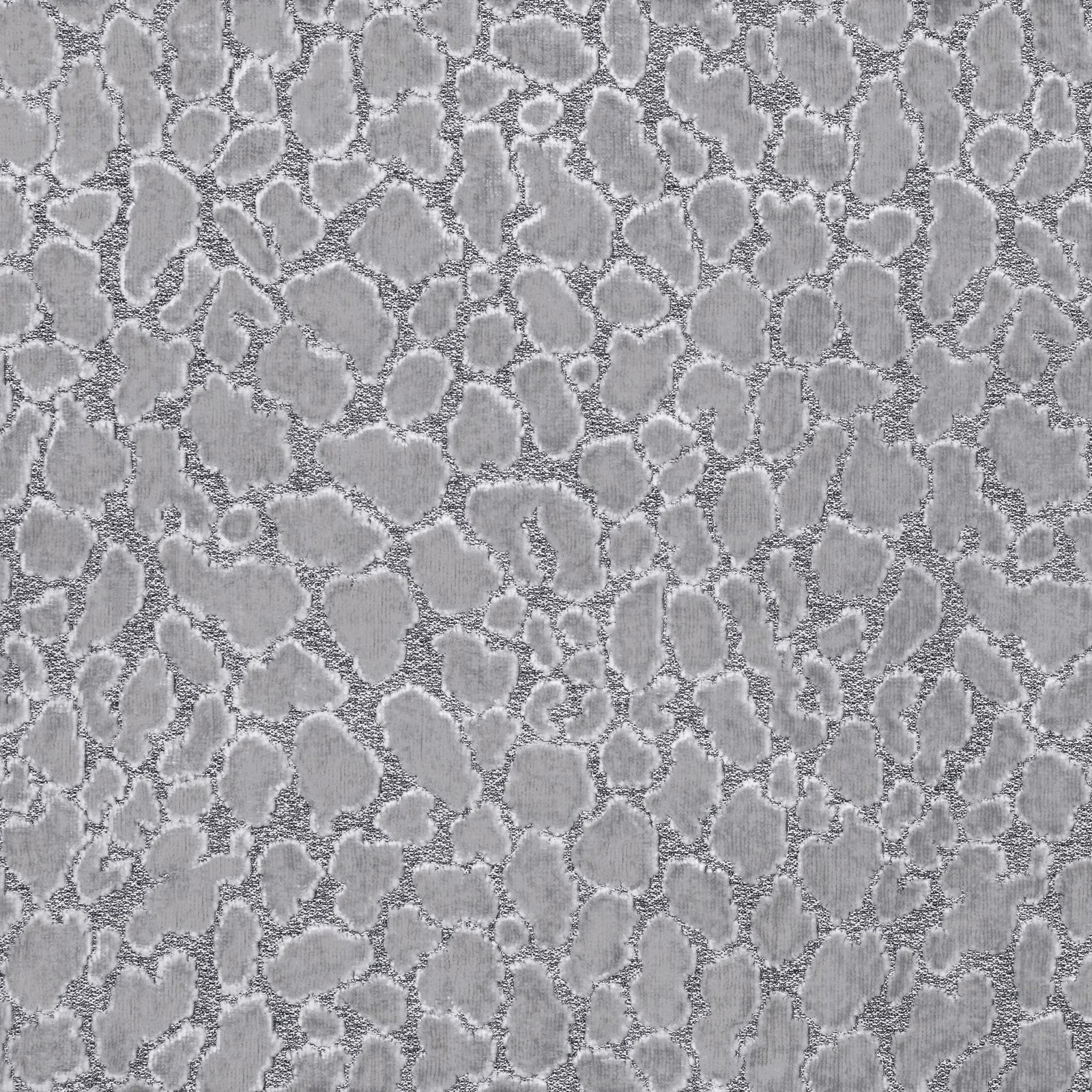 Silver-grey fabric with raised irregular ocelot spots and softly textured edges