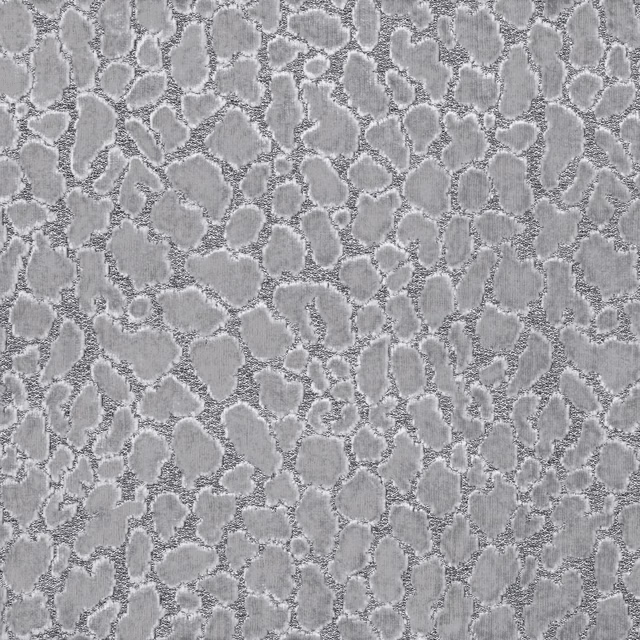 Silver-grey fabric with raised irregular ocelot spots and softly textured edges