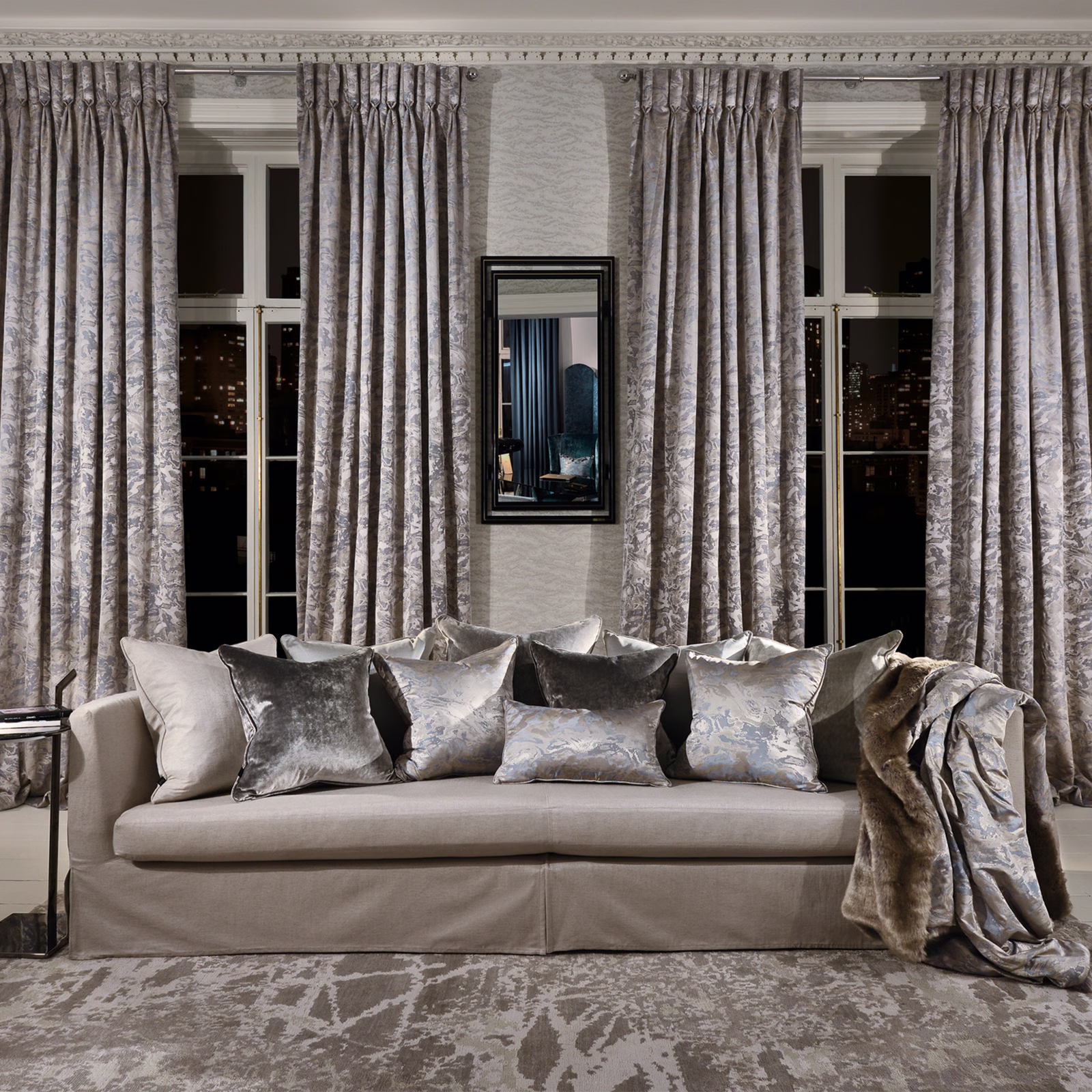 Full-length cool silver-grey curtains in a pleated, softly mottled organic fabric