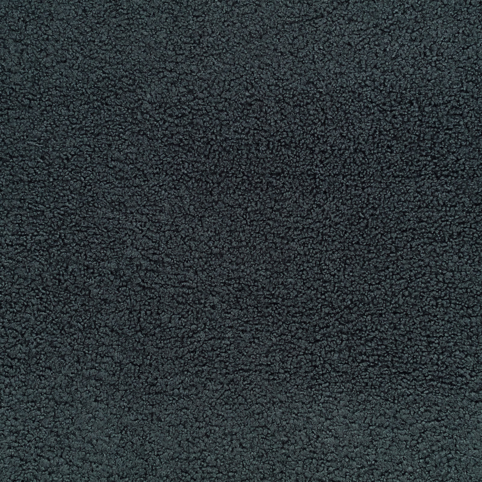 Close-up of dark black-sapphire textile with dense, pebbled loop texture