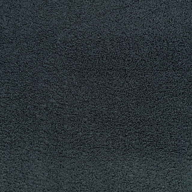 Close-up of dark black-sapphire textile with dense, pebbled loop texture