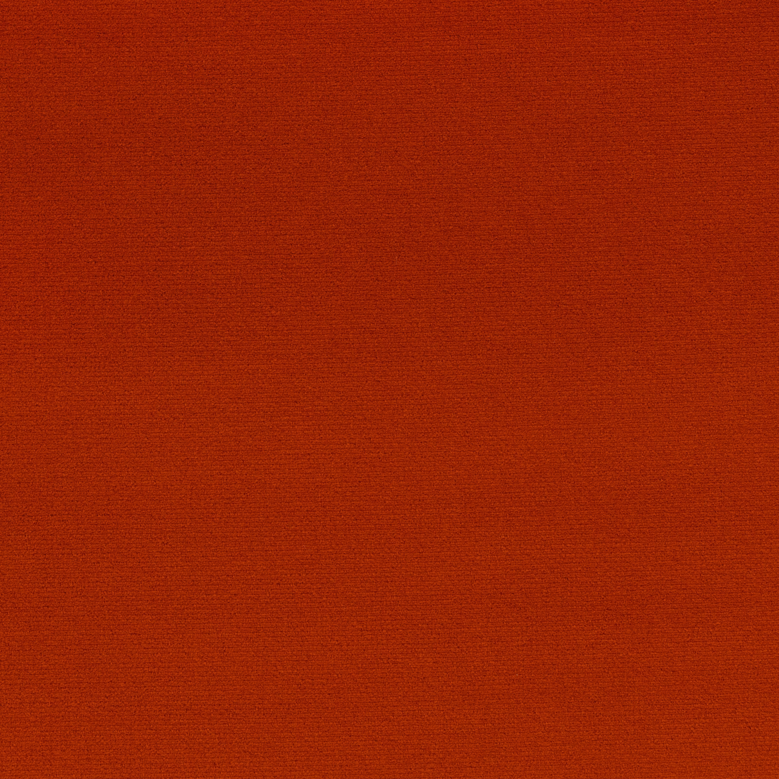 Close-up of deep rust-orange outdoor upholstery with a fine horizontal woven texture