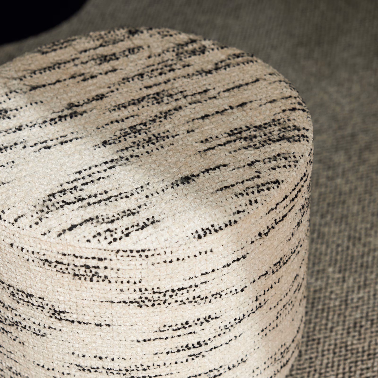 Ivory woven upholstery with broken slate-grey horizontal streaks and a nubby textured surface