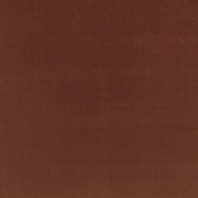 Close-up of warm cognac-brown velvet with a softly brushed, plain surface