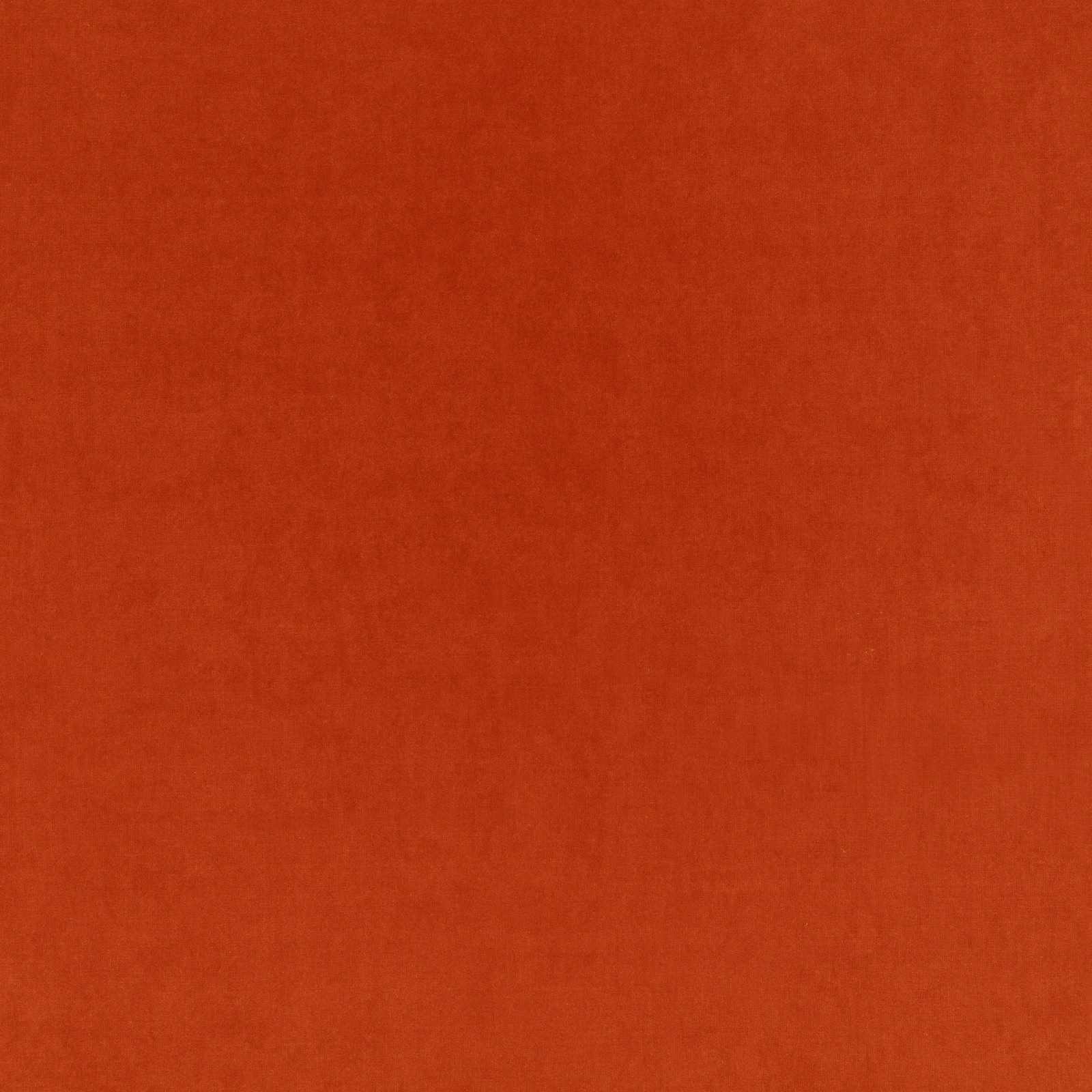 Burnt terracotta velvet with a subtle directional nap and soft tonal shading