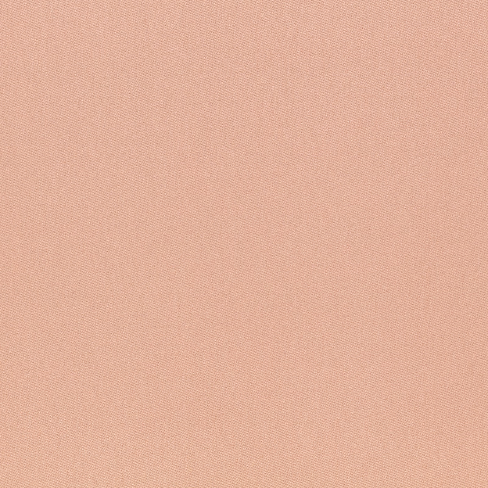 Close-up of plain warm blush-pink fabric with fine vertical woven texture