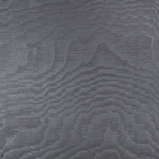 Charcoal-grey woven textile with broad, rippling woodgrain-like bands and subtle surface sheen