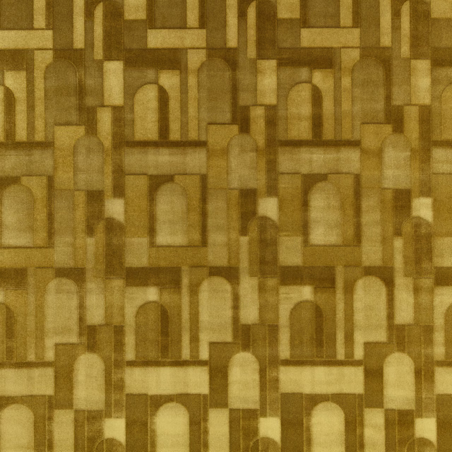 Warm kiwi olive textile showing repeating arches and geometric architectural frames