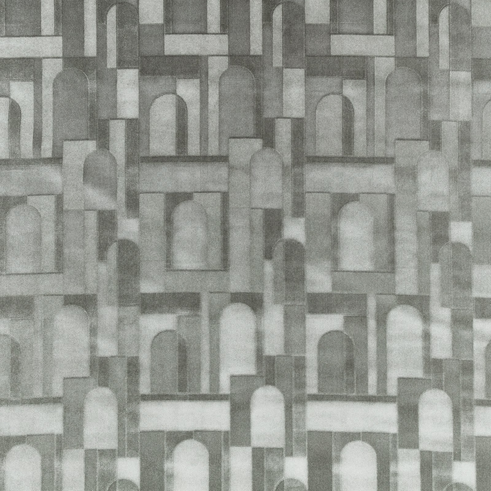 Muted seafoam-grey woven fabric with repeating arches and geometric architectural blocks