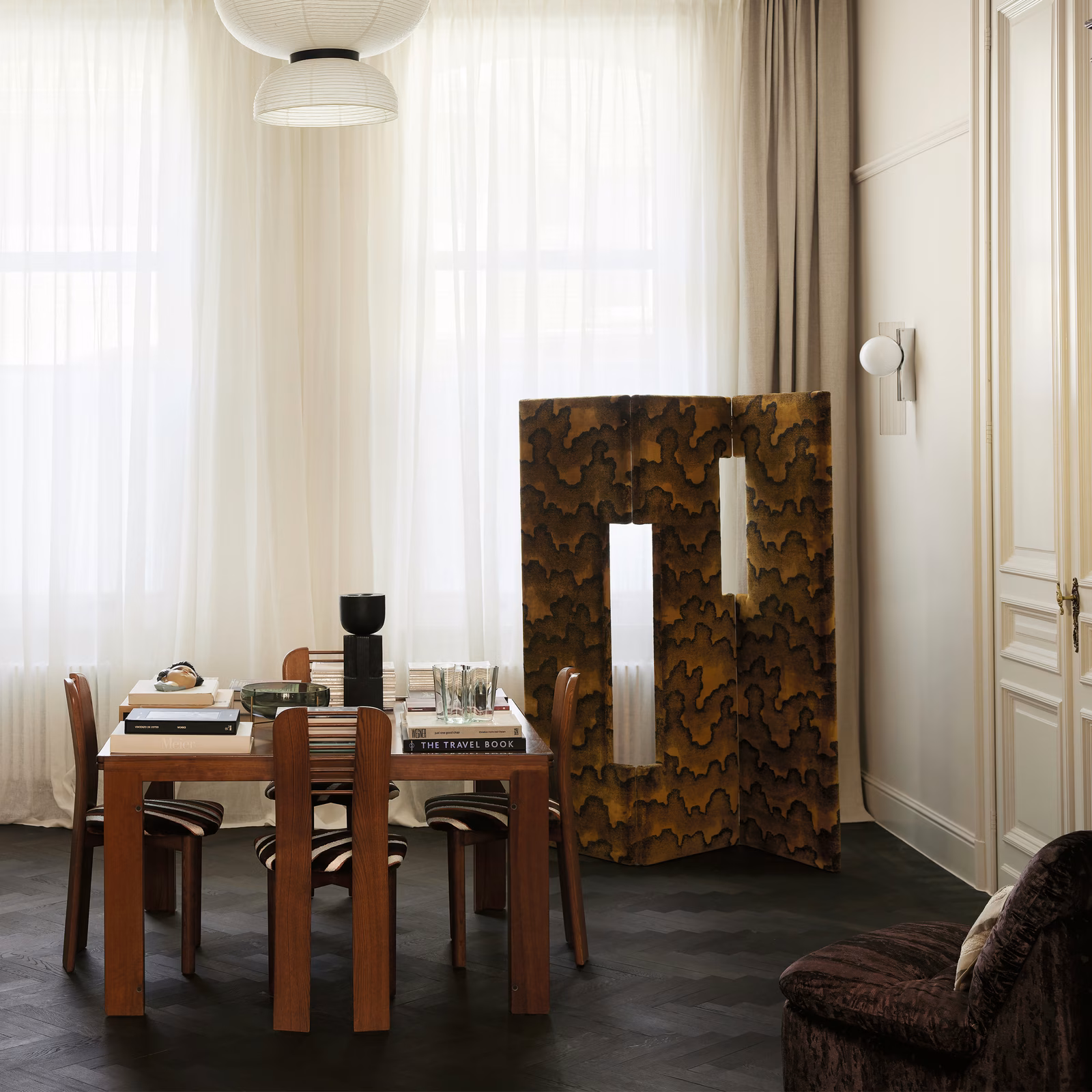 Burnished bronze and dark brown organic patterned fabric upholstered on a folding screen