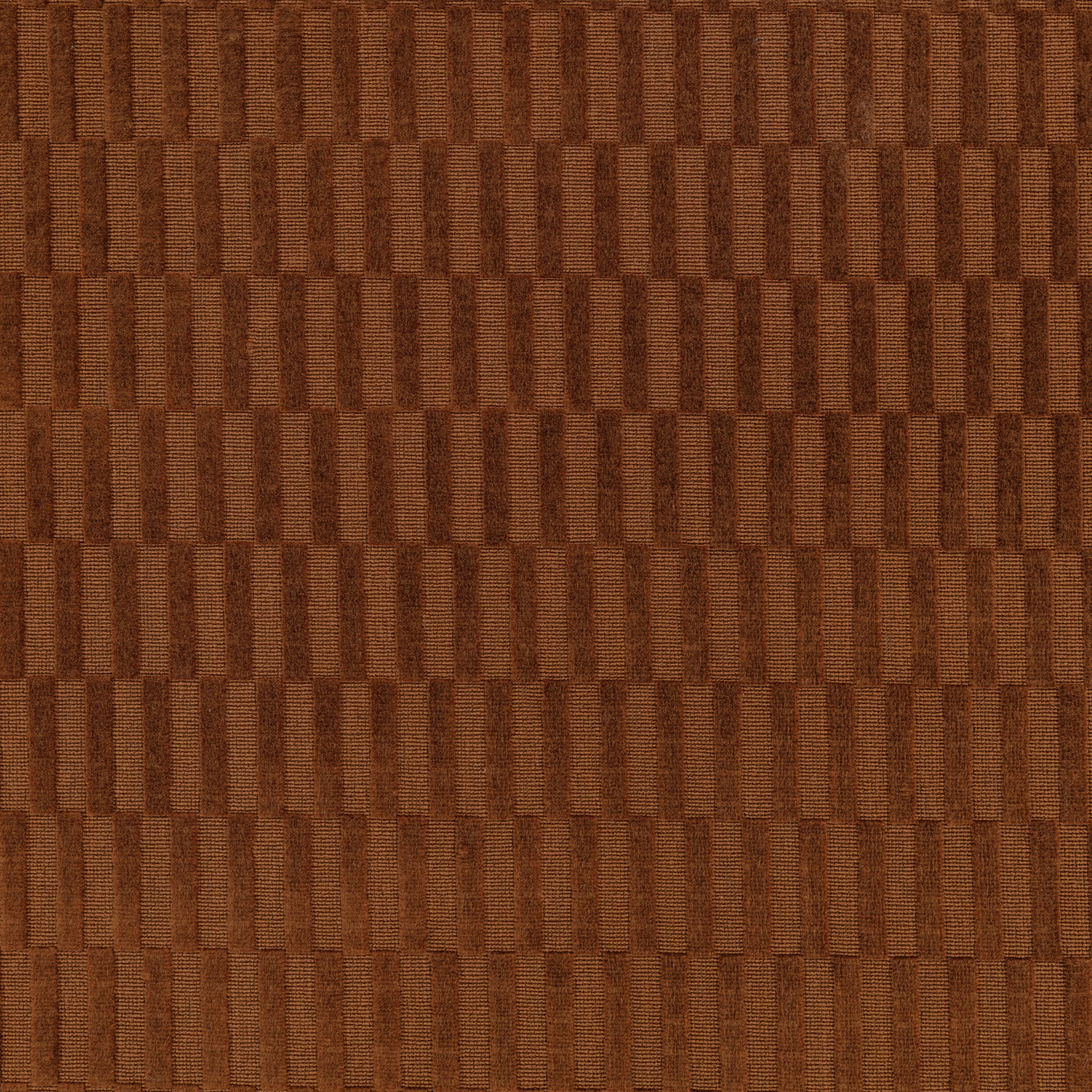 Warm russet-brown woven fabric with vertical rectangular blocks and ribbed texture