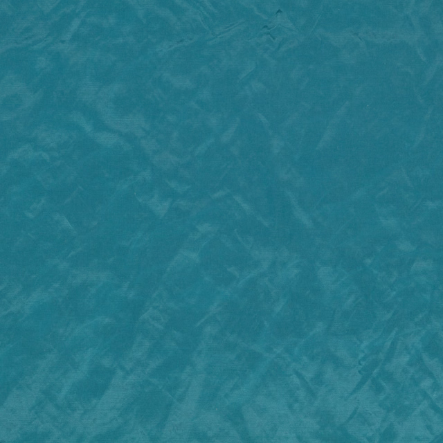 Mottled cerulean teal textile with cloudy blue-green tonal movement