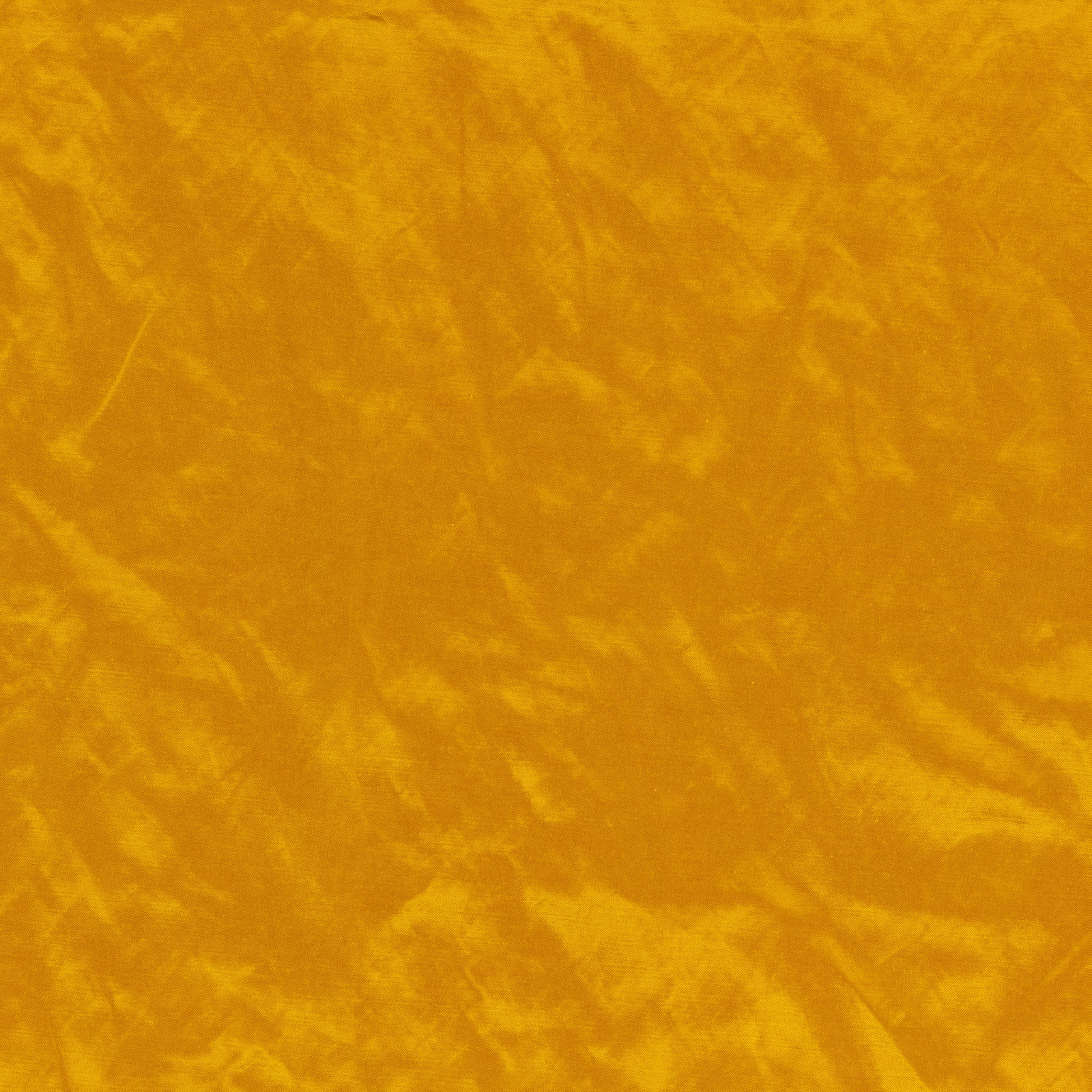 Mottled ochre textile with softly brushed golden velvet-like texture and tonal movement