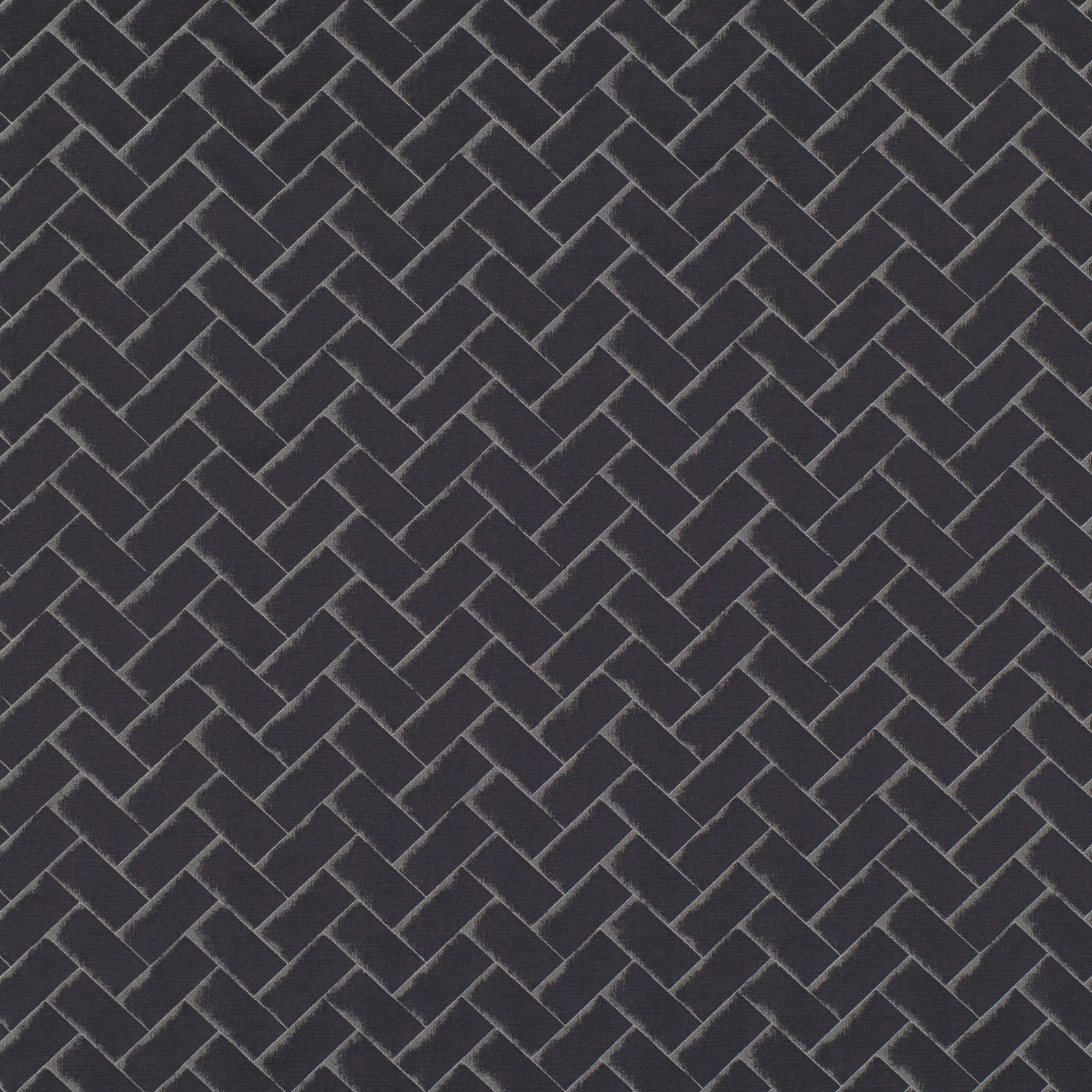 Deep charcoal textile with a fine interlocking chevron weave and lighter grey ridges