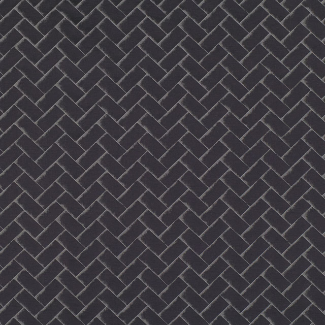 Deep charcoal textile with a fine interlocking chevron weave and lighter grey ridges