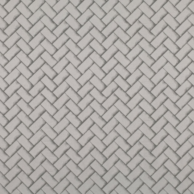 Cool pearl-grey woven fabric with a small interlocking diagonal geometric pattern