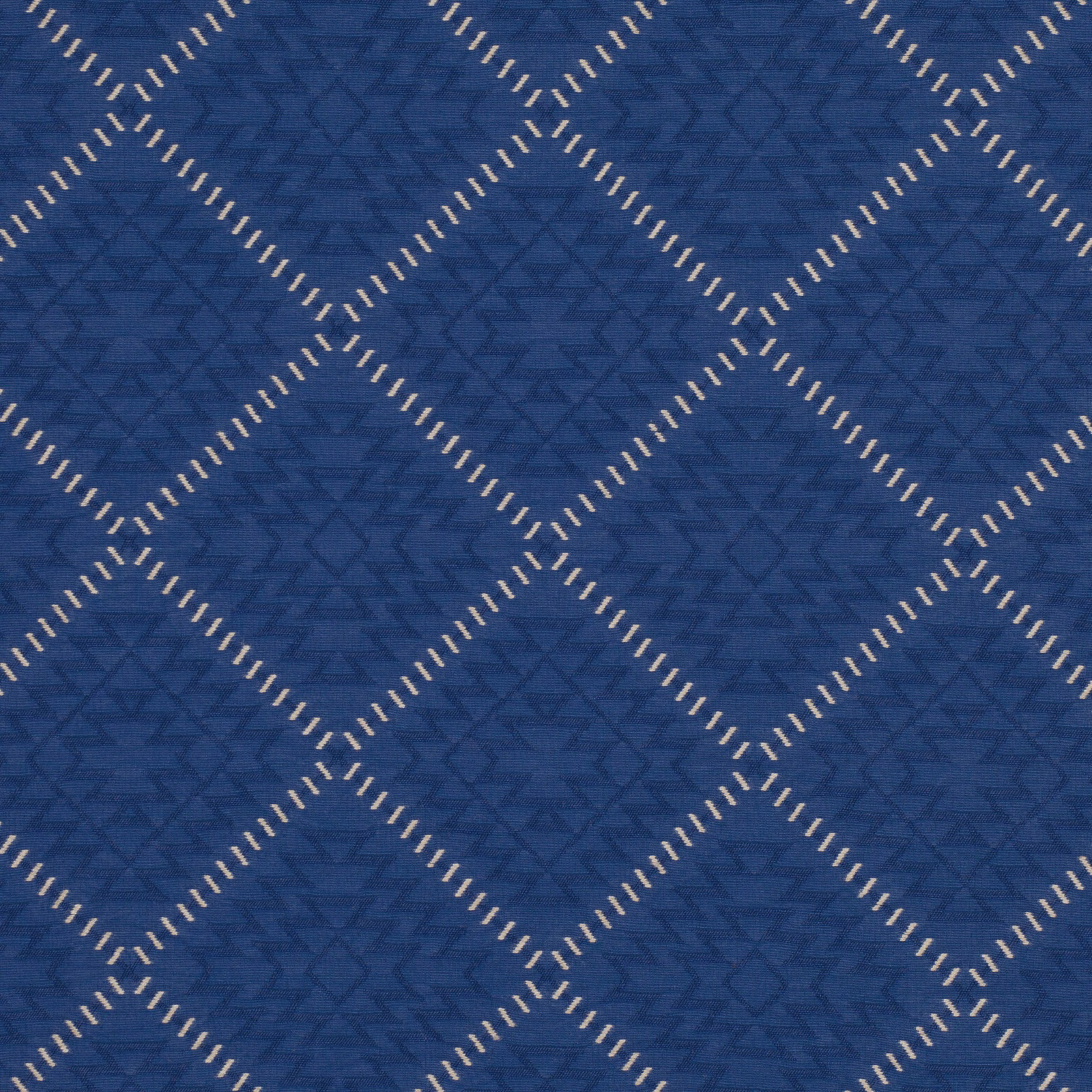 Deep blue woven diamonds with ivory dash outlines and subtle angular texture