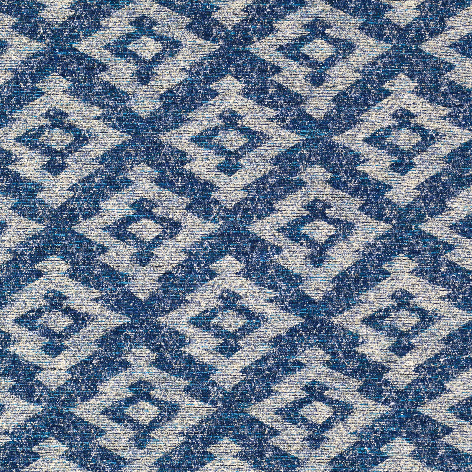 Ink-blue and cream woven swatch with repeated mottled diamond motifs