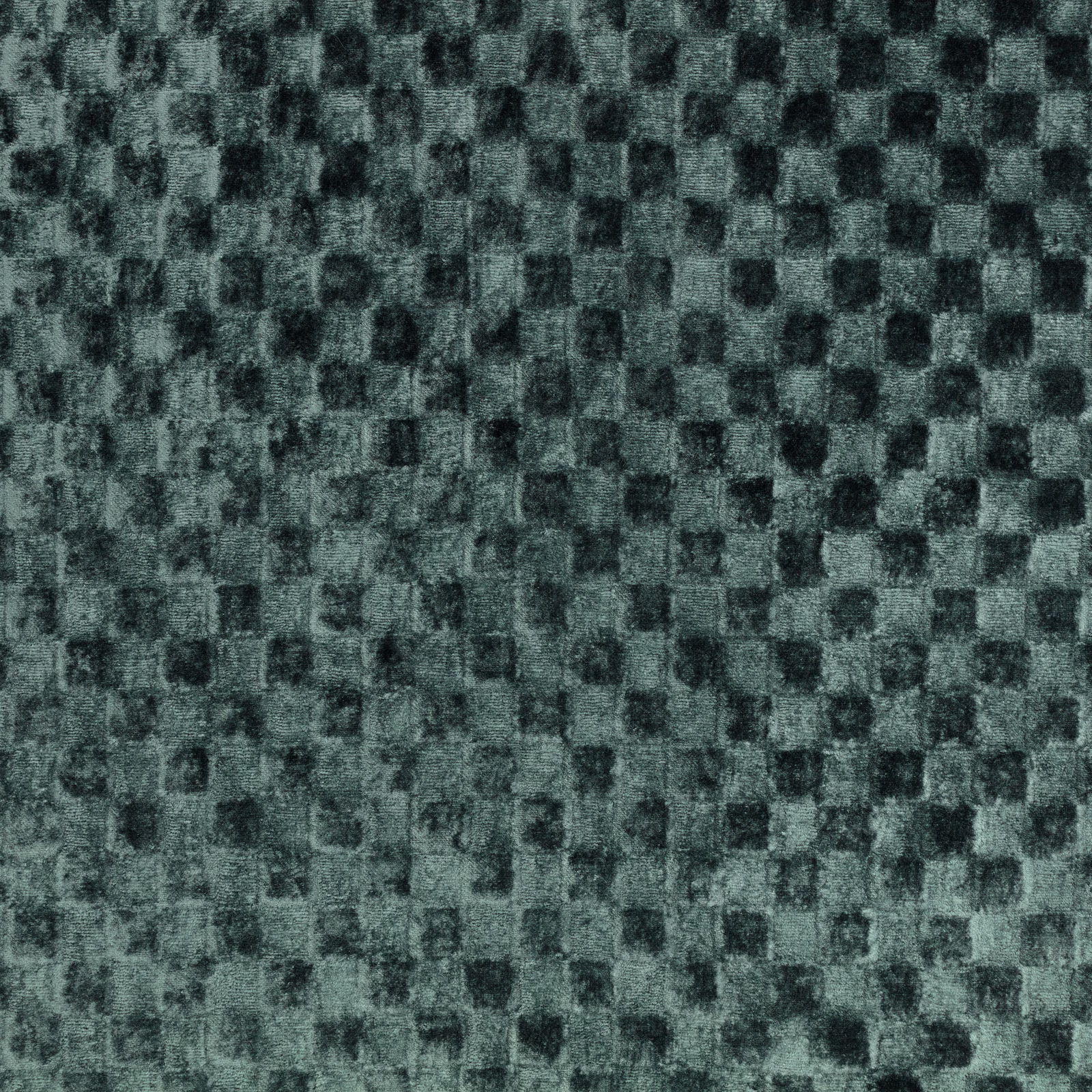 Close-up of deep smoky teal woven checks with charcoal square accents and mottled texture