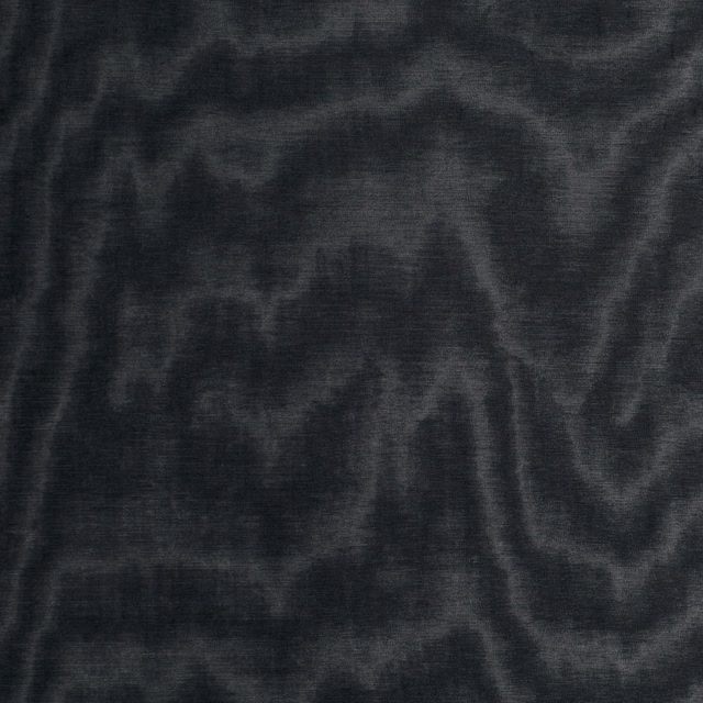 Deep charcoal-black fabric with smoky abstract swirls and a subtle woven sheen