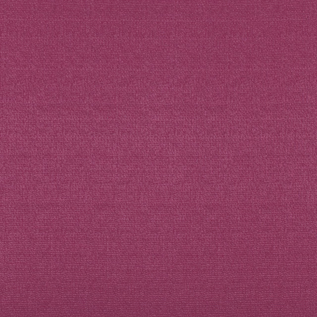 Close-up of richly textured dusky raspberry pink woven upholstery fabric
