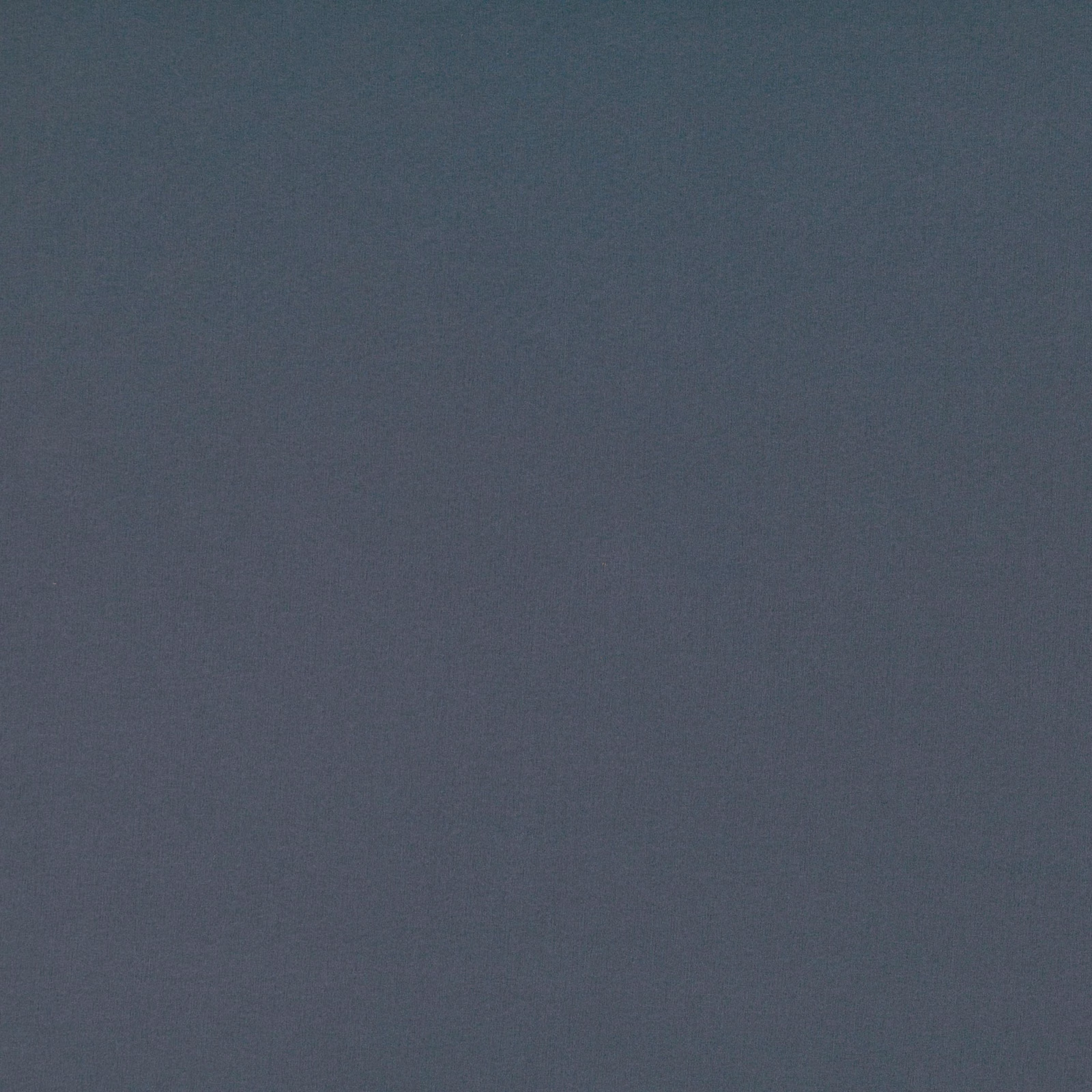 Close view of muted carbon blue fabric with a fine, subtly textured weave