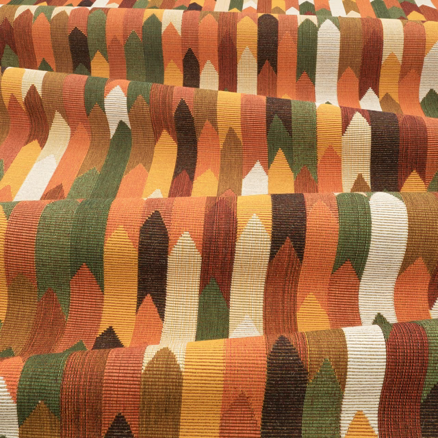 Rust, ochre, olive and cream ribbed geometric textile with repeating pointed forms