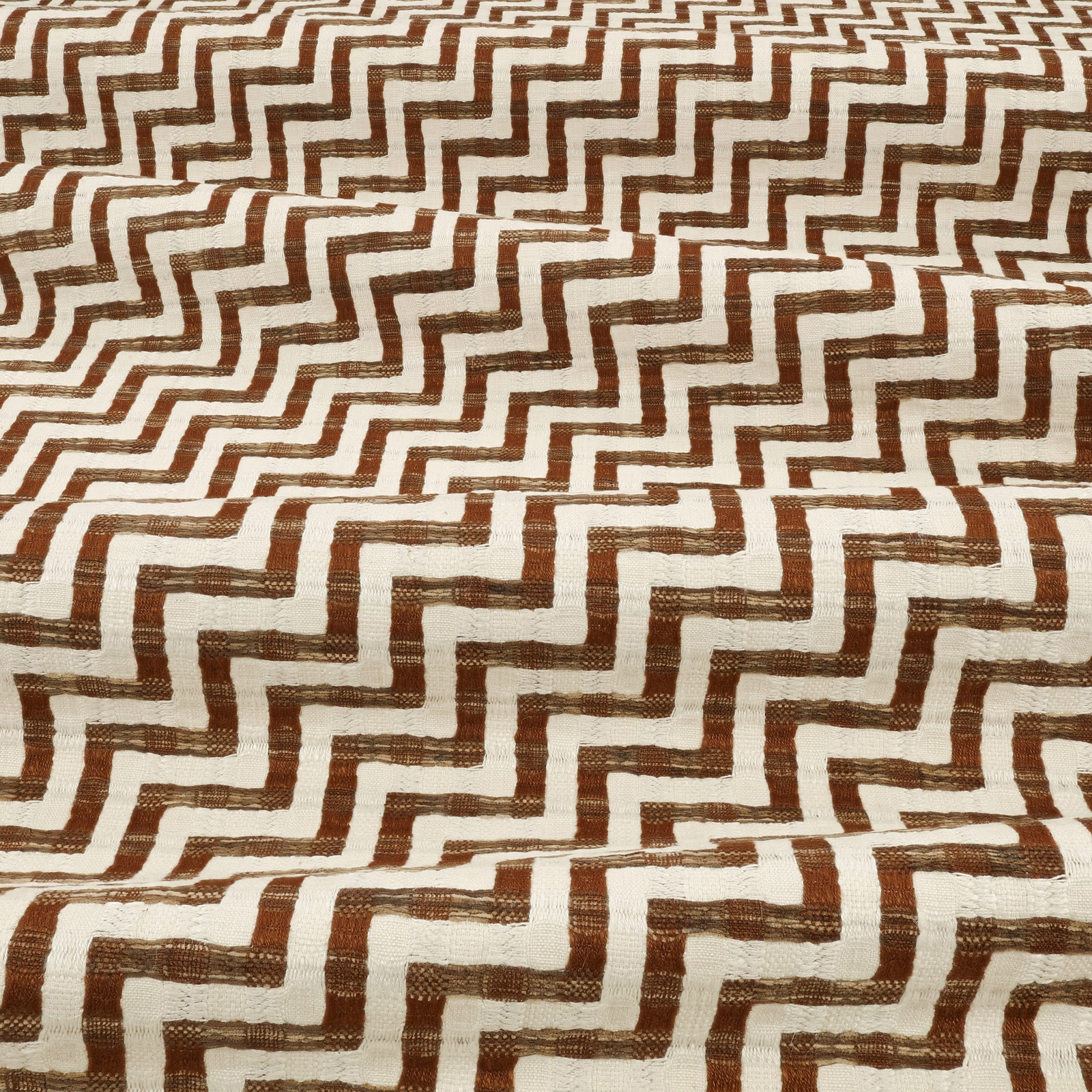 Warm teak-brown stepped lines on a textured ivory woven fabric