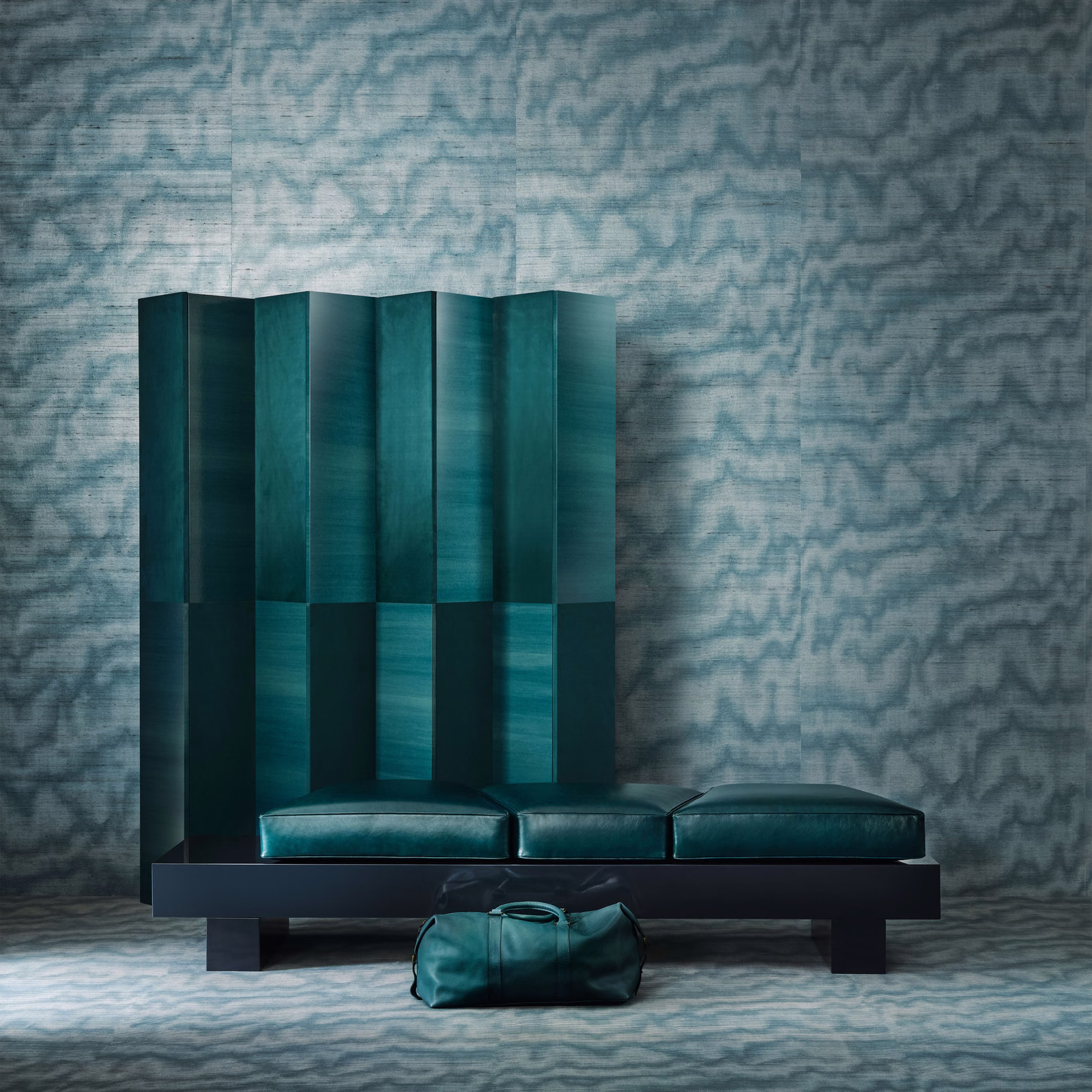 Electric teal upholstery with rippled tonal blue-green pattern and subtle surface sheen
