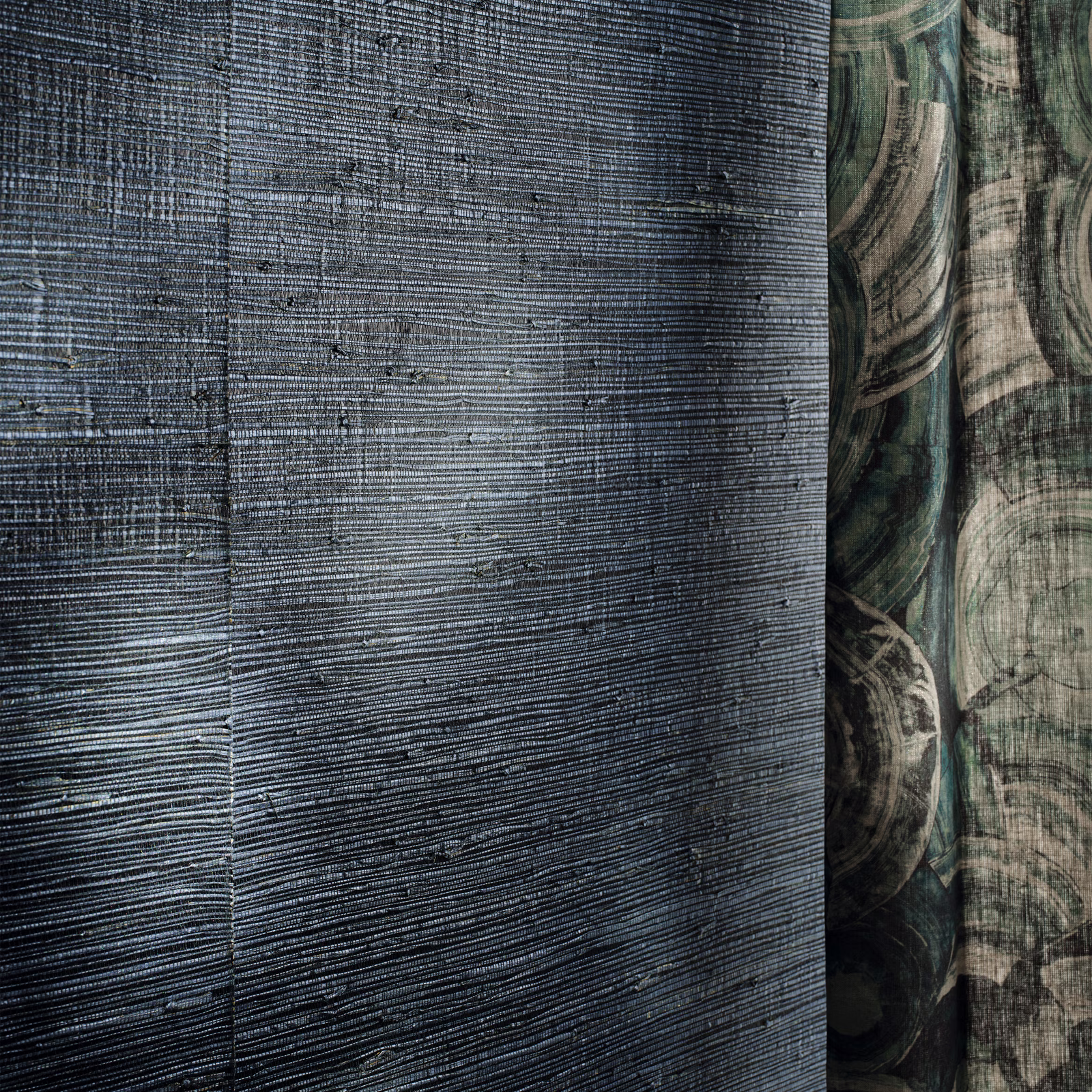 Deep blue-grey wallpaper with fine horizontal striations and shadowed organic arcs