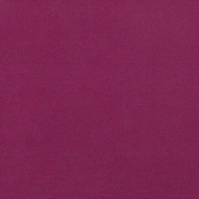 Close-up of deep raspberry-red fabric with a fine, subtly textured weave
