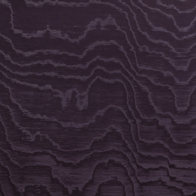 Dark aubergine textile with charcoal woodgrain lines and subtle horizontal sheen
